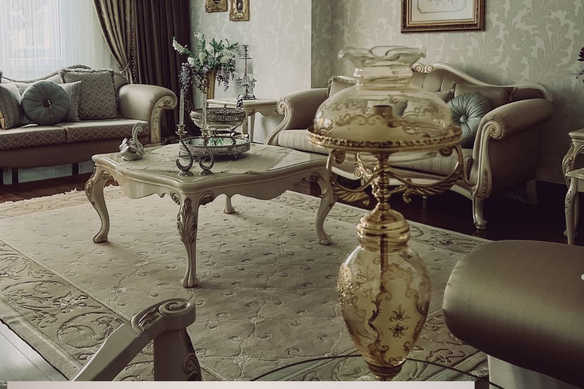 A living room featuring a gold and white sofa paired with a coffee table, highlighting furniture repair details.